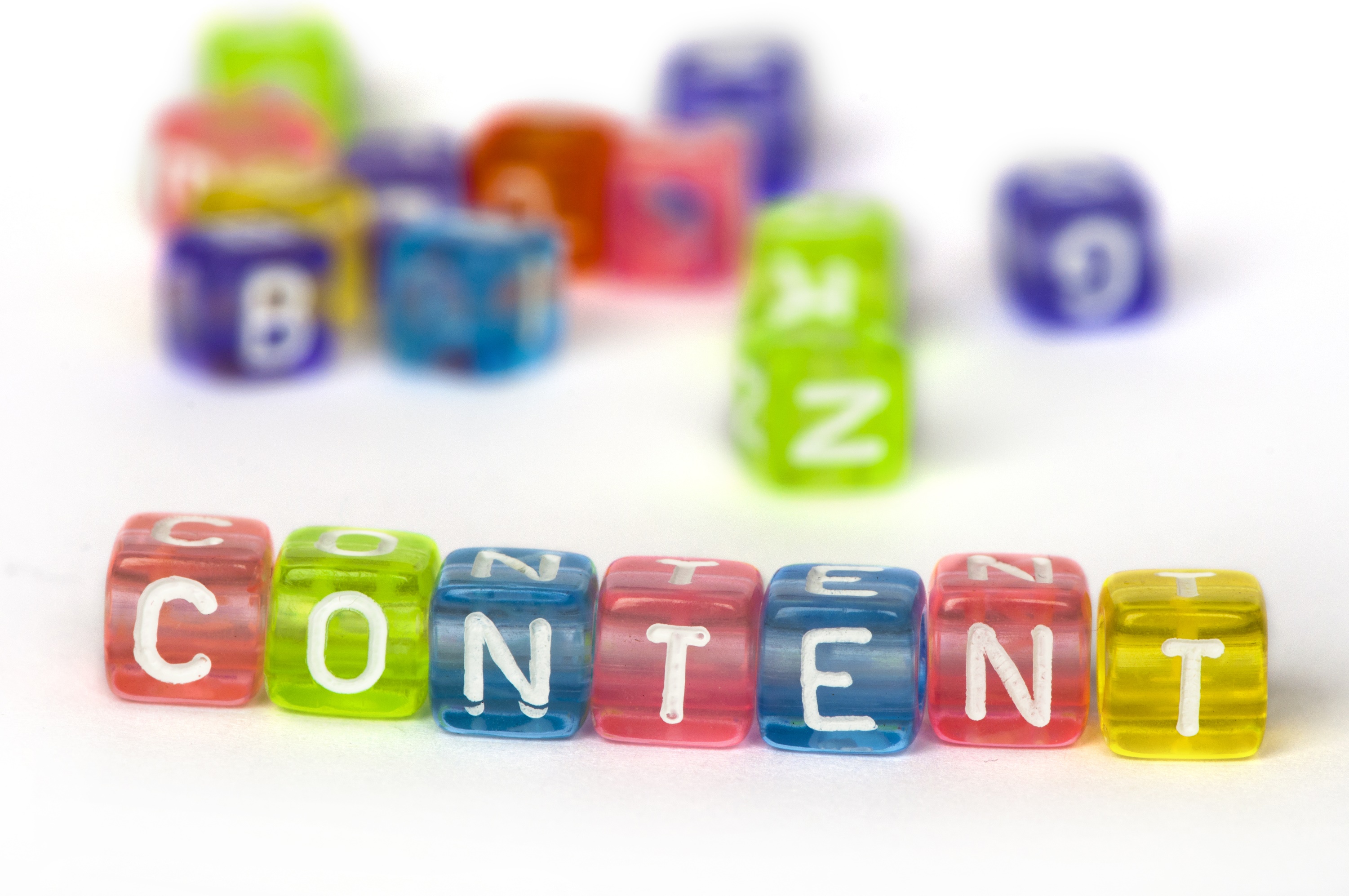 Text Content on colorful wooden cubes over white